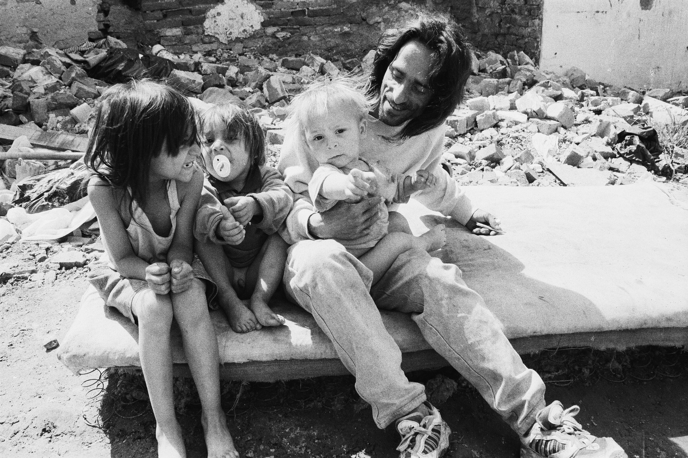 Grayscale Photo of a Man Holding a Kid